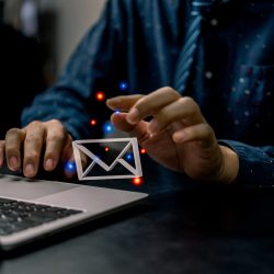businessman-using-computer-laptop-checking-email-icon-3d-online-sending-mail-partner-customer-web-with-virtual-interface-technology-concept-min
